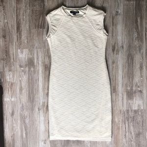 Ivory bodycon mini dress.
